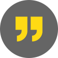 A yellow quotation mark on a black background